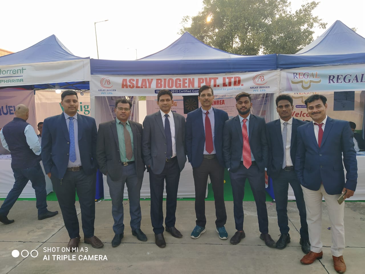 Aslay Biogen team outside the company exhibition stall at a pharmaceutical trade show