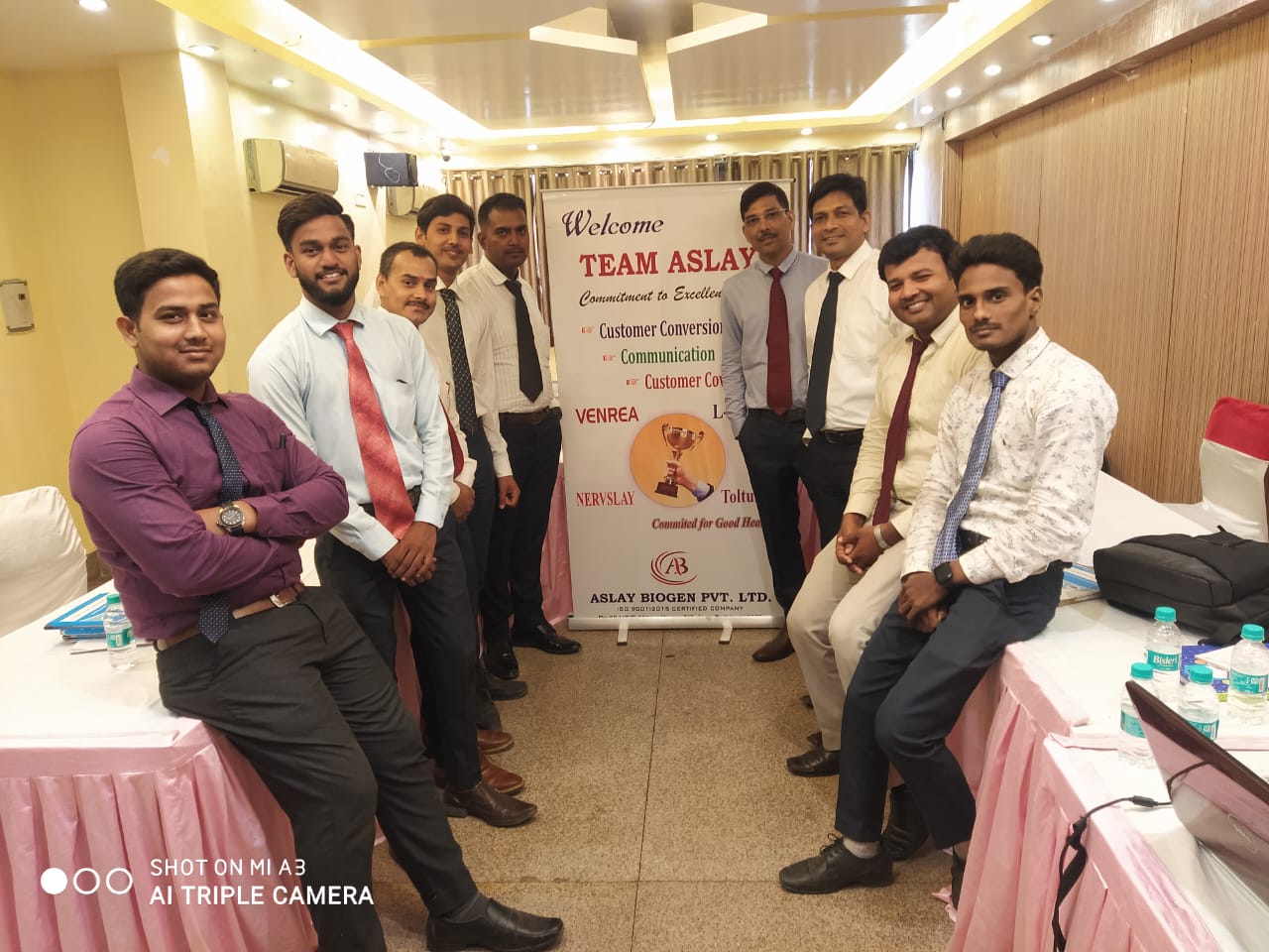 Team Aslay sales meeting with a Venrea, Nervslay and Toltuf product banner